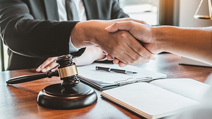 Attorney and client shaking hands